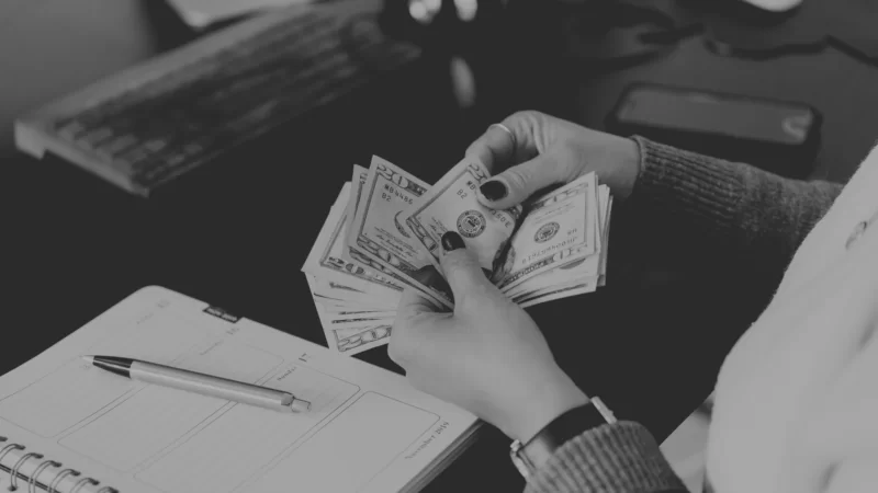 Energy Efficiency Professional counts the money they've made.