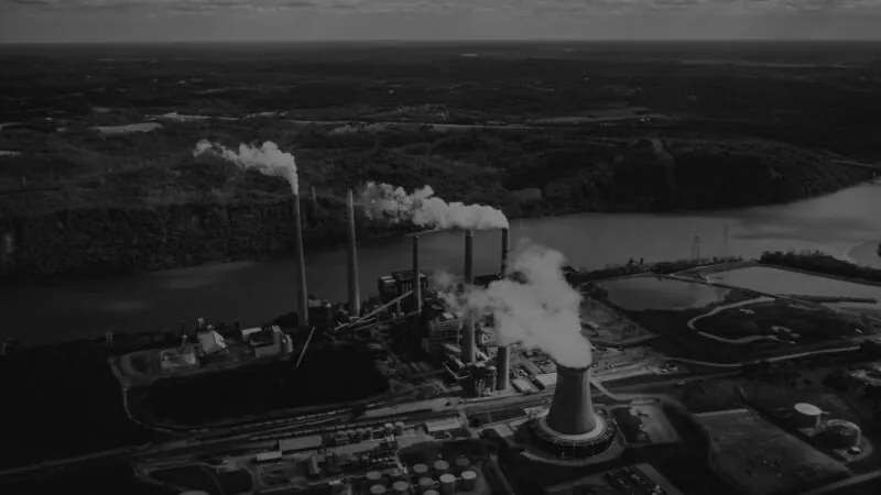 Net Zero Council represented by ab ig factory chugging out emissions