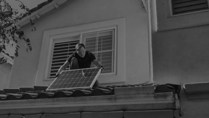 Man Installing Solar Panel B&W