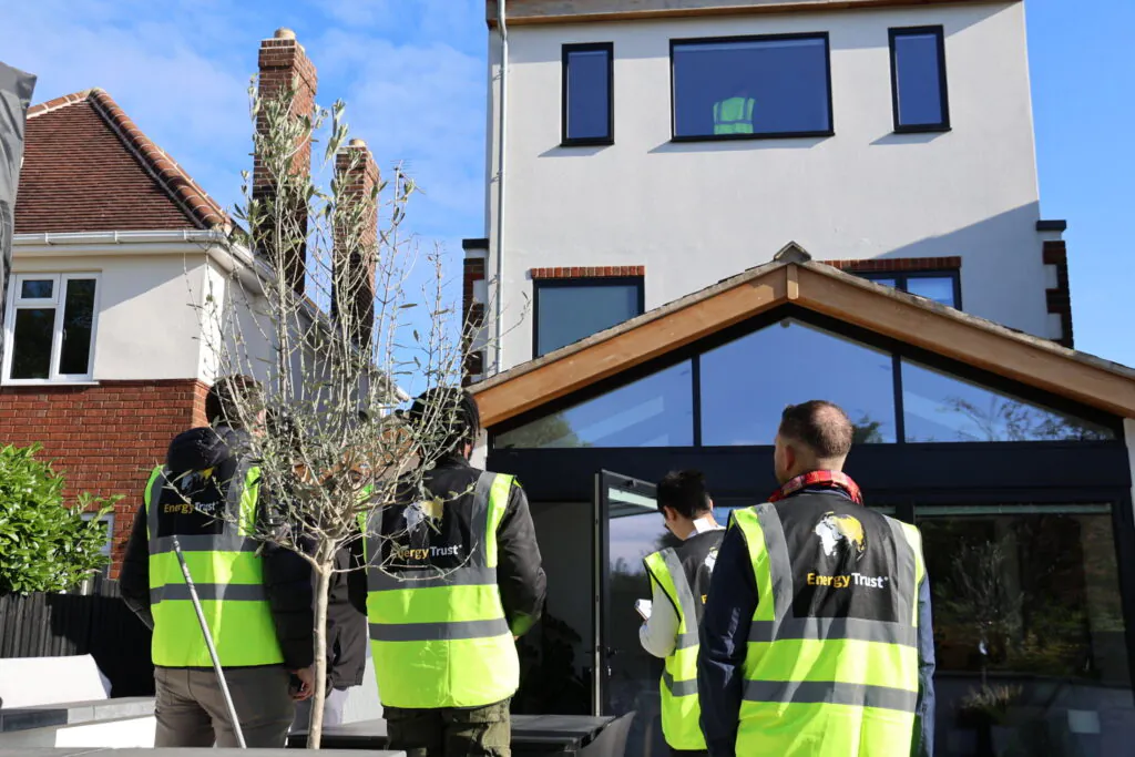 Domestic Energy Assessors on site, looking at a house to assess it to create an energy performance certificate (EPC)