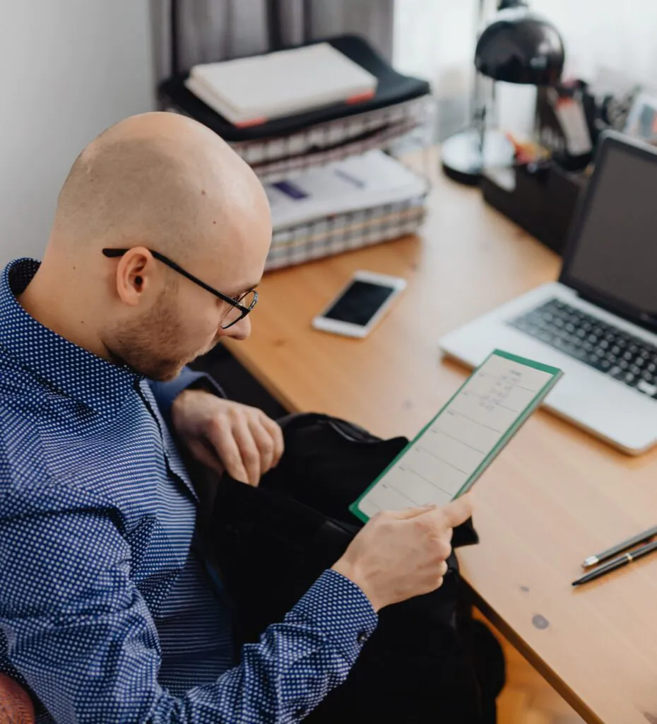 Retrofit Coordinator working at his home desk