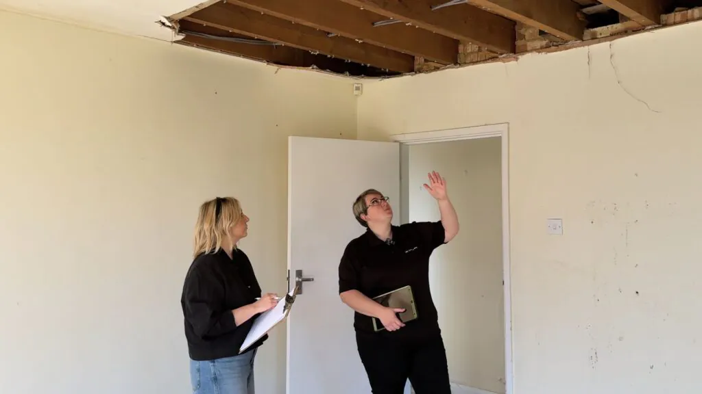 Retrofit Coordinator Explaining Issues To Client